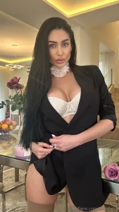 And when the lace peeks out under the suit it s not weakness it s a