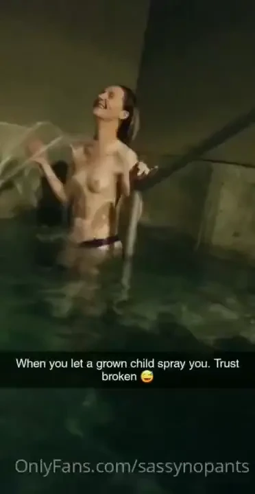 Getting sprayed with cold water in a hot springs by my lady friend 