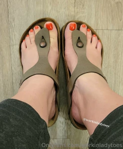 Lazy monday in my birks my bright orange toes look fabulous don t you