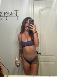 Summers here which means you will find me in a bikini with a beer in