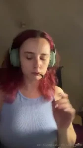 Painting my nails and smoking a cigarette while wearing headphones