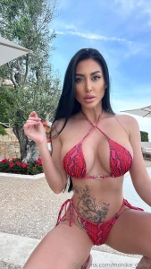 Style doesn t take a break even poolside a red swimsuit wet hair