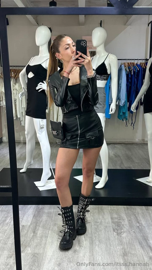 Rocking a classic black jacket and skirt for a chic modeling look do 