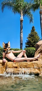 Rogue outside during the day enjoying some pool side lounging