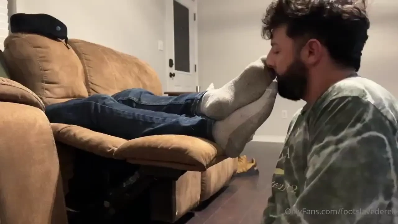 Mastsr john s back silent worship while he lounges on the couch after 