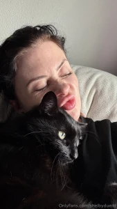 Two cuties in bed but only one is allowed to scratch