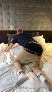 Trying to take a quick nap in a hotel room sagging my shorts low below