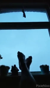 My arched feet silhouetted against a beautiful thunder storm my