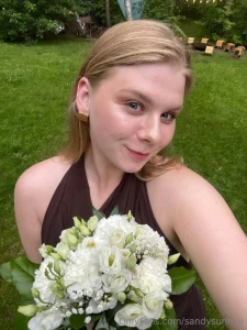 Natural beauty shines brightest with a flower in hand