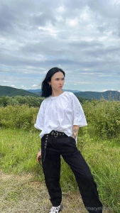 In this photo i am standing on a hill admiring the majestic mountains