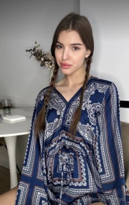 Adorned with delicate braids i glide in a serene dance wrapped in a