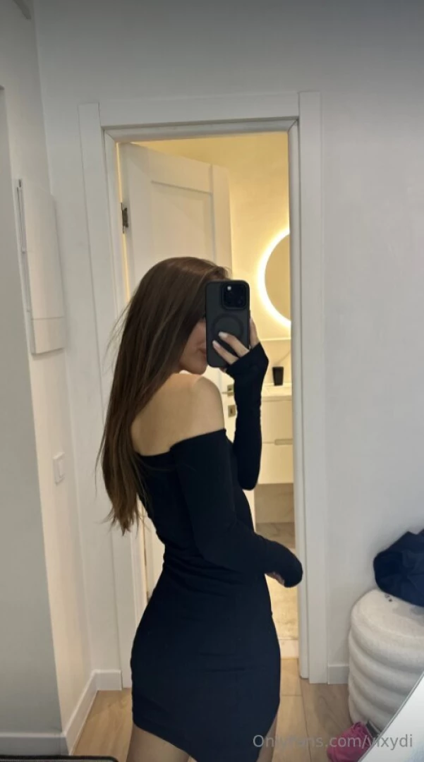 Stepping out in style in this chic black dress ready to conquer the 