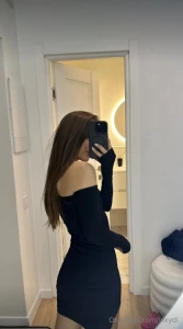 Stepping out in style in this chic black dress ready to conquer the