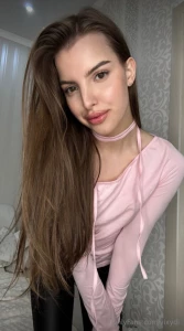 Draped in the soft elegance of a beautiful blush pink sweater where