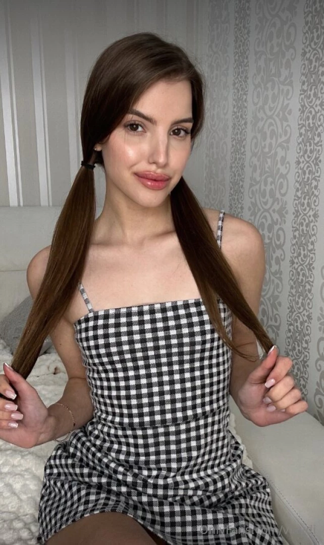 Wrapped in timeless sophistication with this checkered dress embracing 