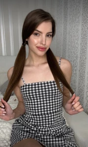 Wrapped in timeless sophistication with this checkered dress embracing