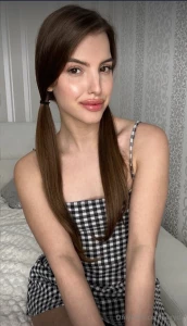 Wrapped in the timeless femininity of a checkered dress every square