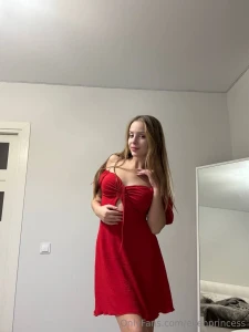 A woman wraps herself in a beautiful dress literally lives in it she