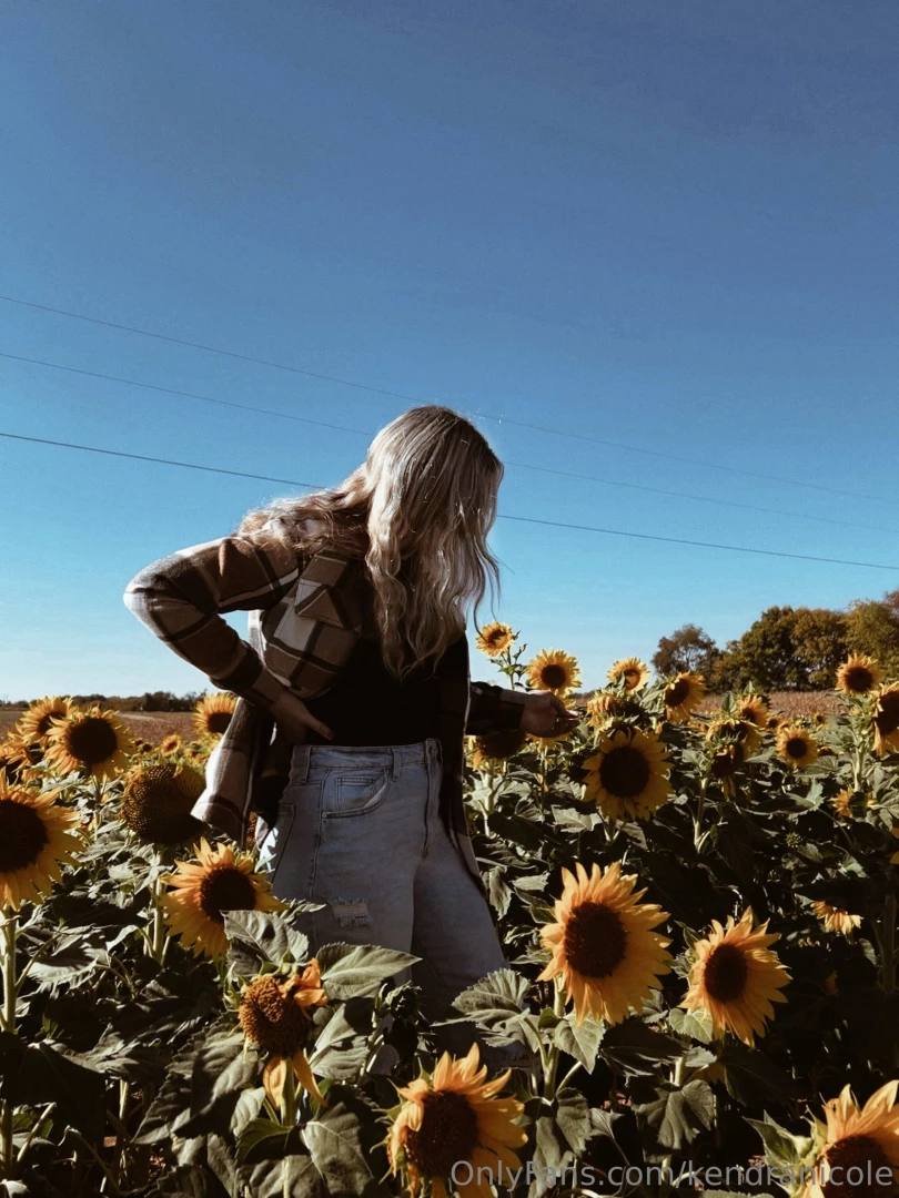 Smiling under the sunflower sky 