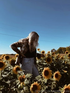 Smiling under the sunflower sky