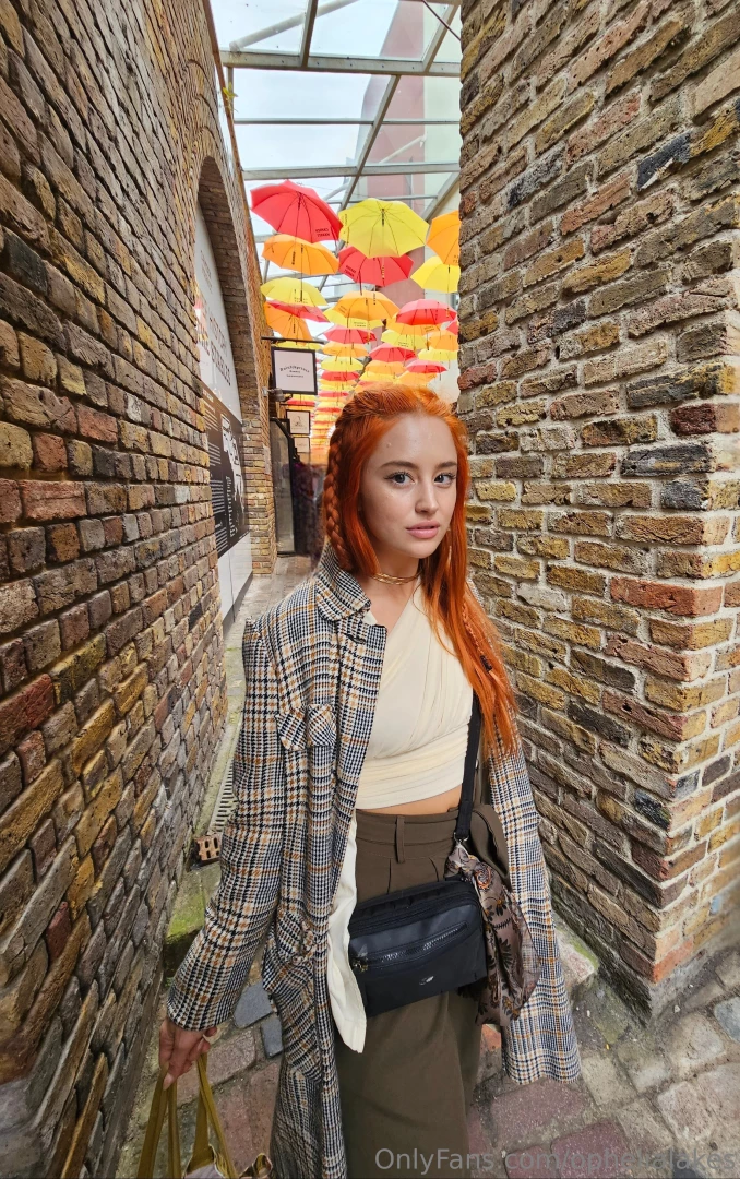 Walking under a sky full of color at this umbrella art exhibit the 