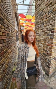 Walking under a sky full of color at this umbrella art exhibit the