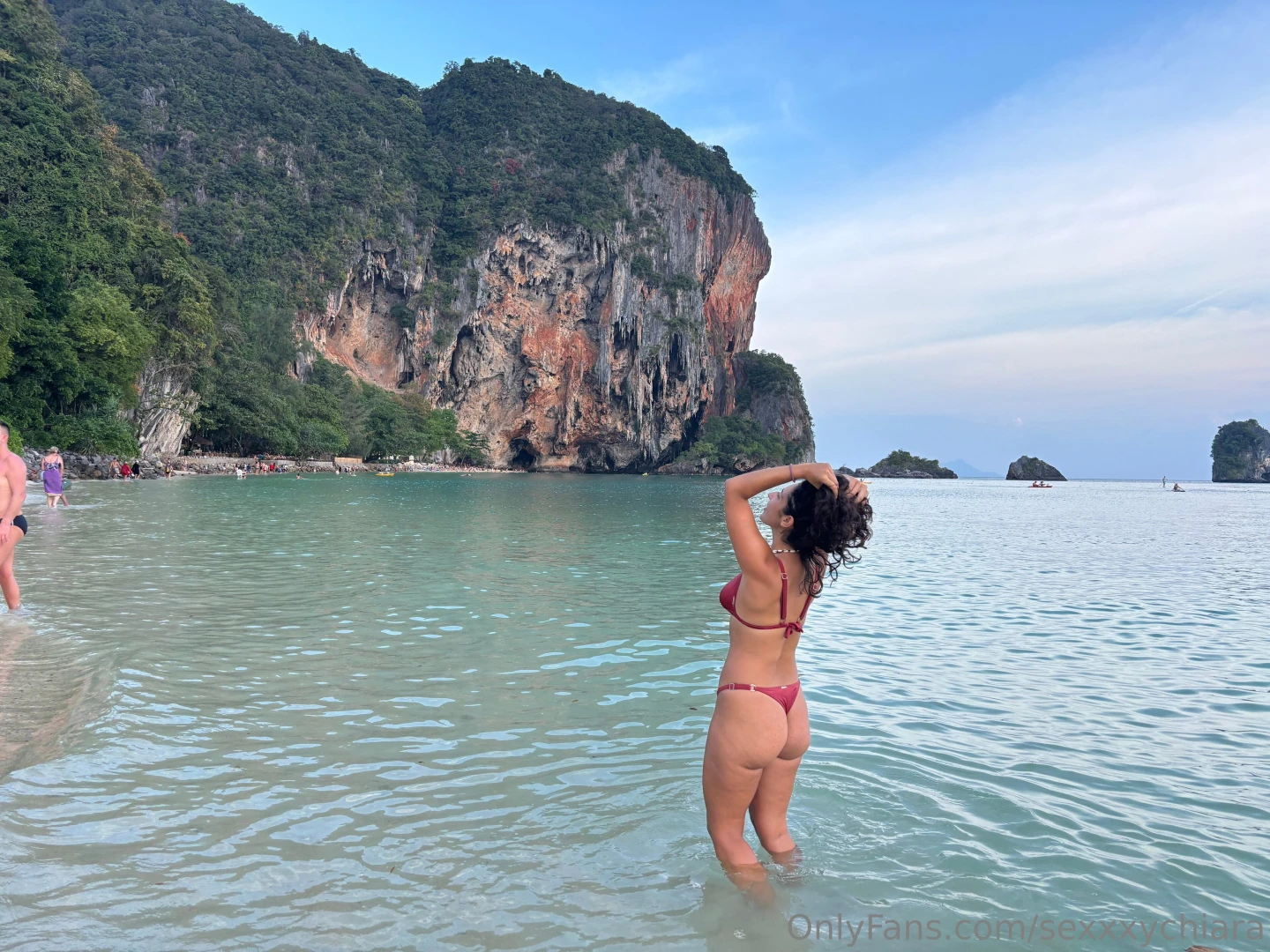 Splashing at the beach feeling naughty under the sun with bikini or 