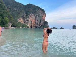 Splashing at the beach feeling naughty under the sun with bikini or