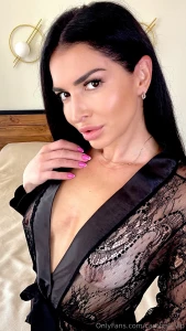 A see-through black robe with nothing underneath ready for a closer