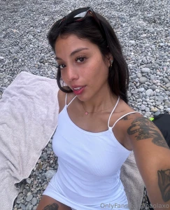 White dress and wet toes but the energy s all fire