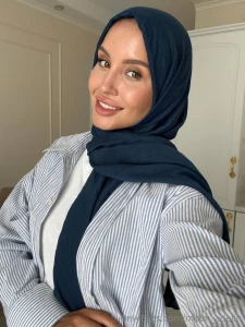 In the soft light of the table lamp the pages seem alive - whispering