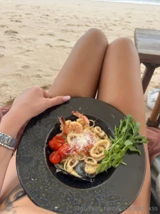 Sunset paints the sky in warm tones a sea breeze caresses the skin and