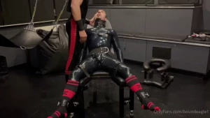 Gimp slave is restrained to the bench and milked by me in full rubber