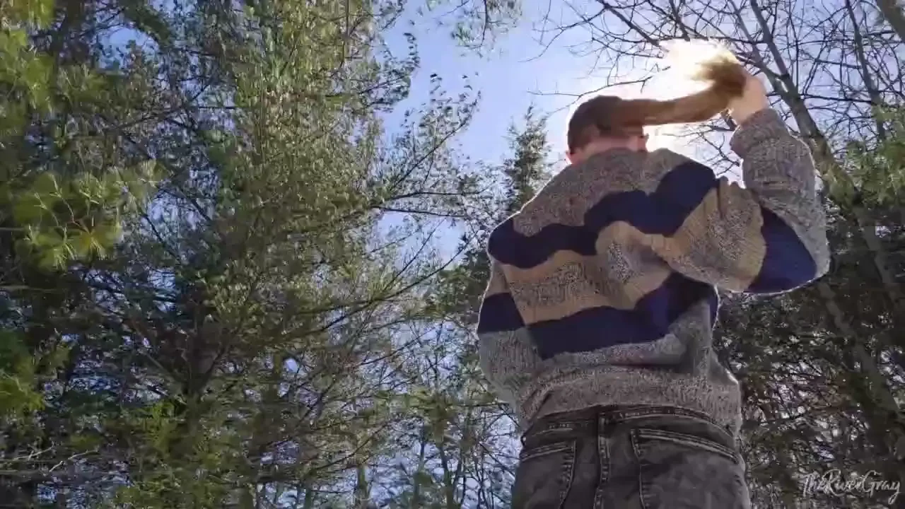 Outside putting my hair in a ponytail twice on a hike showing off my 