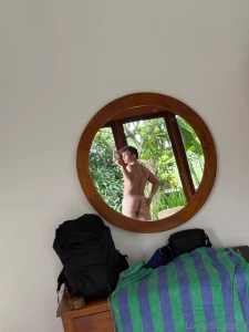 Little natural lighting looks like the mirror is a perfect height for