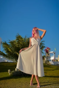 A white airy dress like the vestment of an angel easily and gracefully