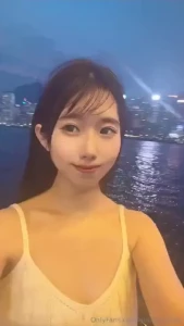 Mei surrounded by beautiful night view in hong kong i blink a lot