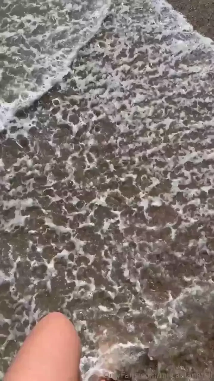My feet in the beach sand and the sea red nails part 2 