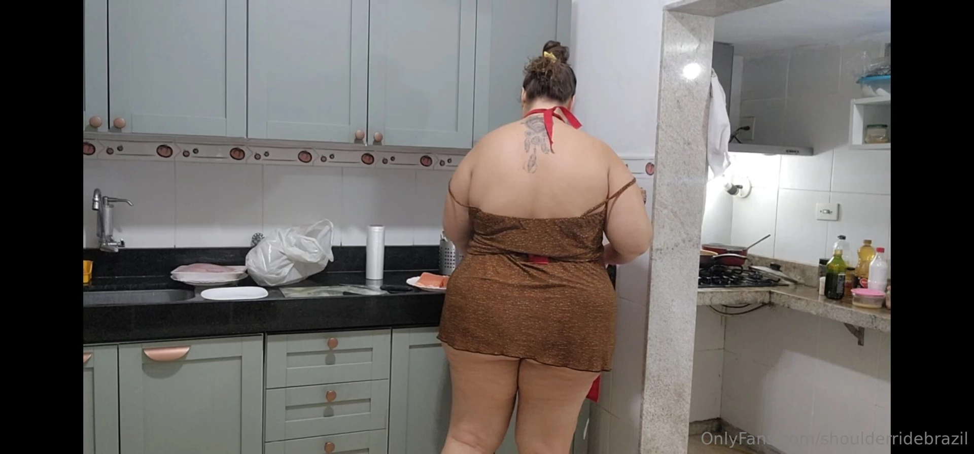 Girlfriend cooking salmon for our saturday lunch 
