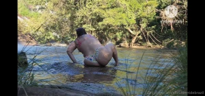 Couple having fun in the waterfall