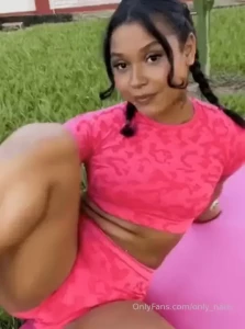 Stretching my leg up high in tight pink shorts while doing yoga every