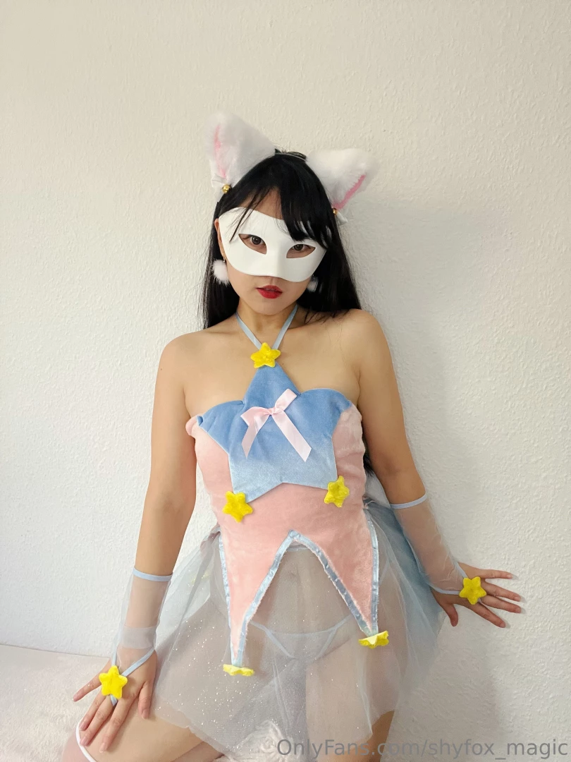 The bodice is adorned with shimmering yellow stars reminiscent of the 