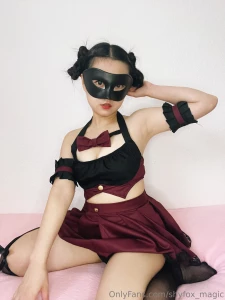 The rich deep tones of the burgundy skirt cascade with a soft