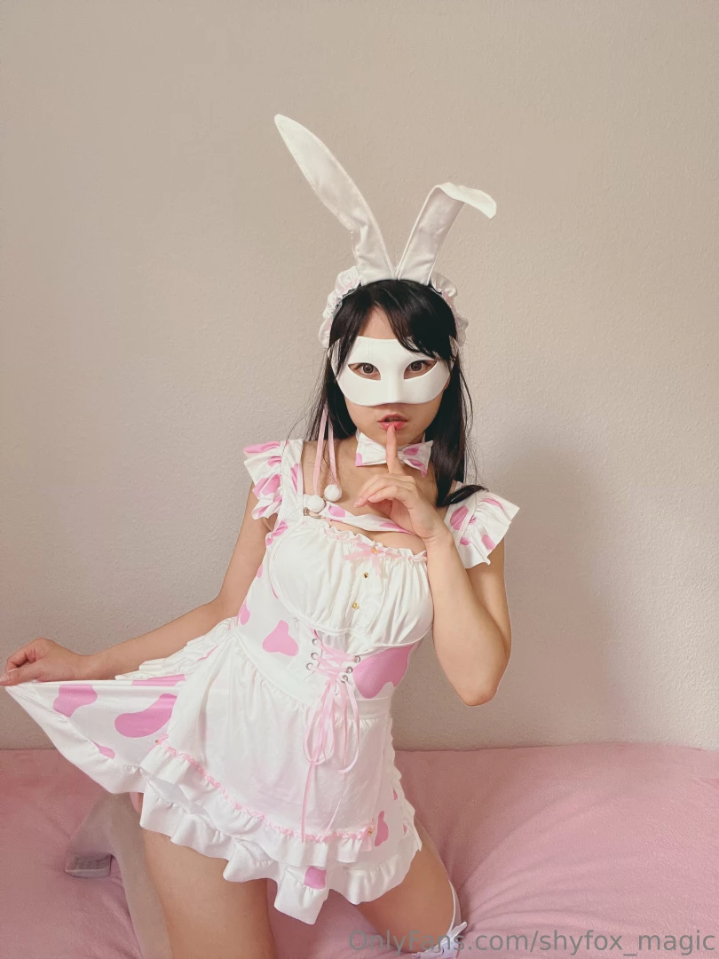 This costume features soft white fabric adorned with cute pink hearts 
