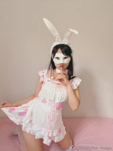 This costume features soft white fabric adorned with cute pink hearts