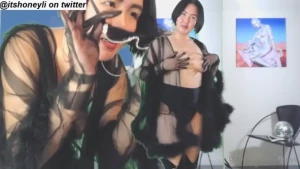 Her bosom heaved as she boobed tittily around the room