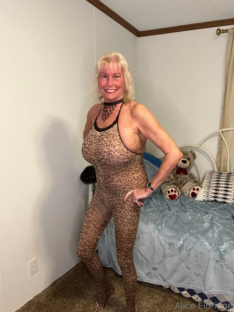 Modeling this one-piece leopard suit and it is crotchless easy access 