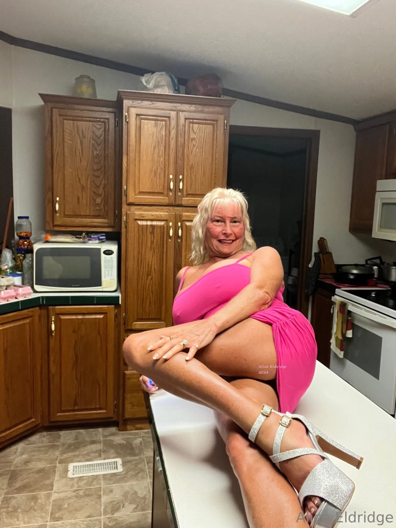 Having fun in pink dress with platform high heels 