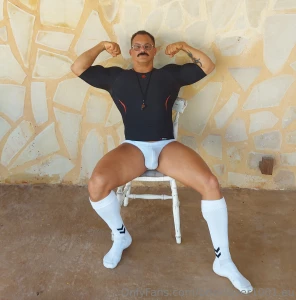 Coach sitting his big muscle ass down while he watches his boys play part 1