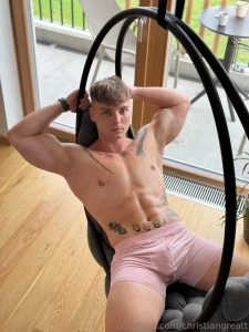 Lying back on the indoor swing relaxed and in control boxers snug